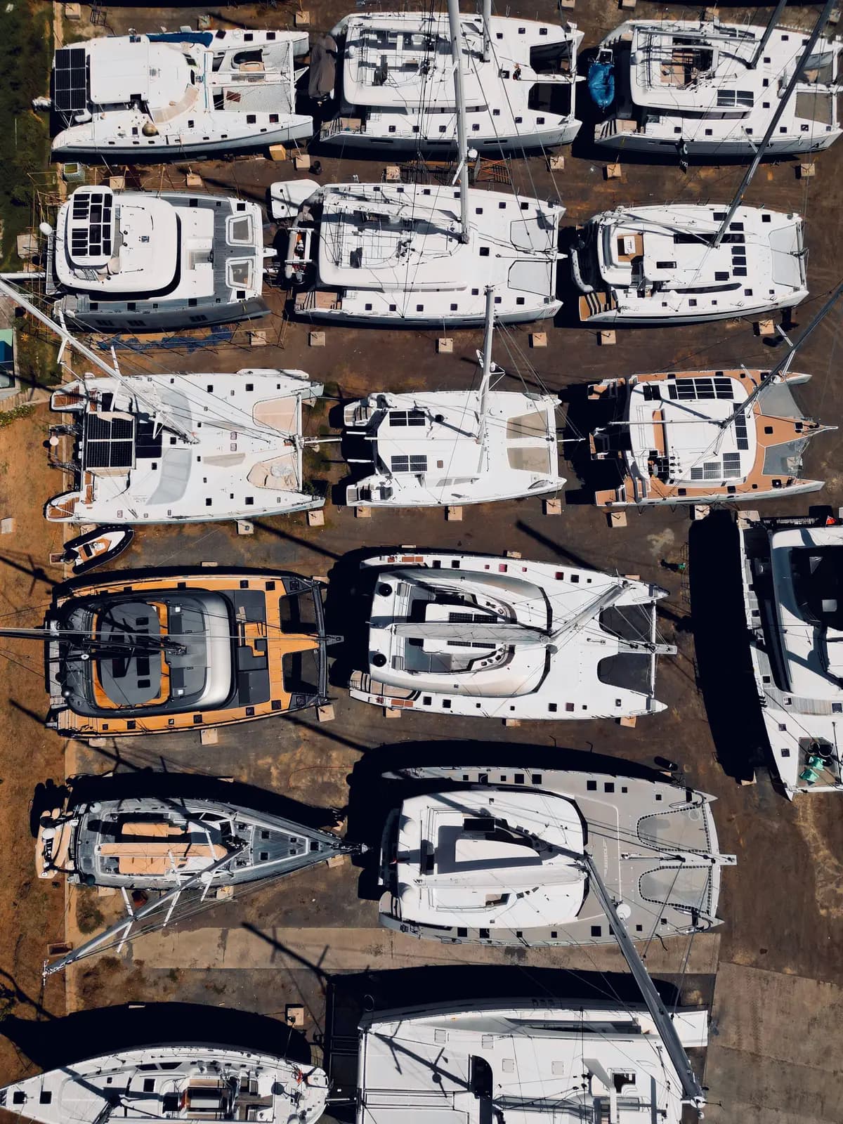 Sailboats in a dry docking yard, seen from above