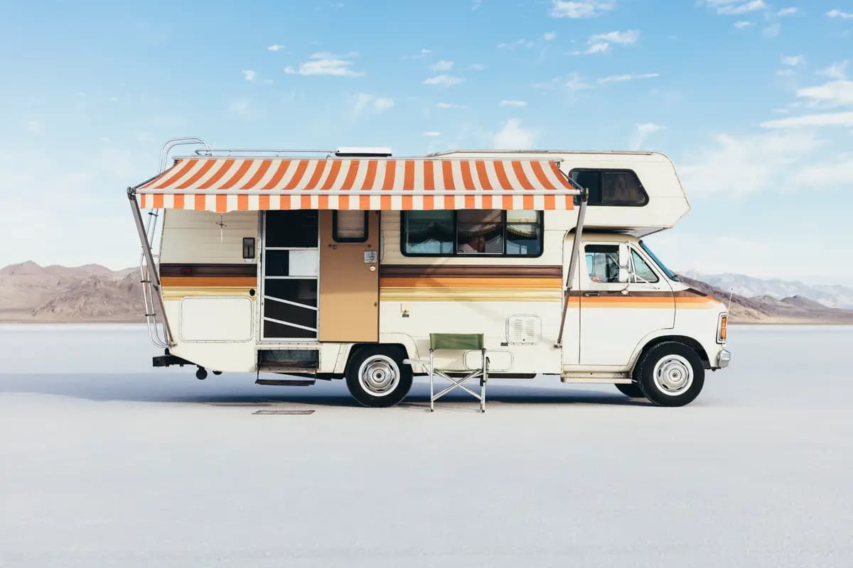 A camper van parked in open desert