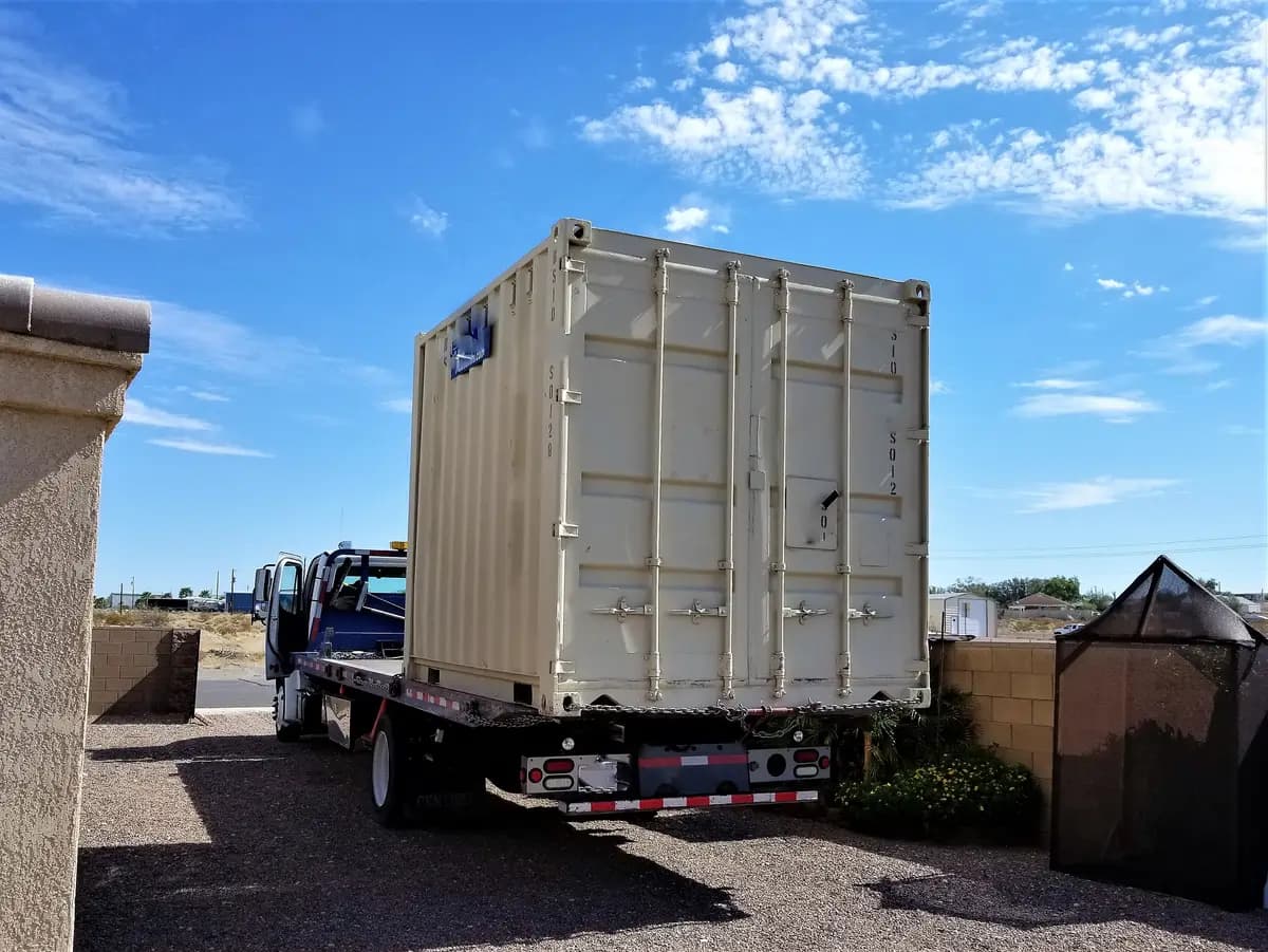 A shipping container on a delivery truck