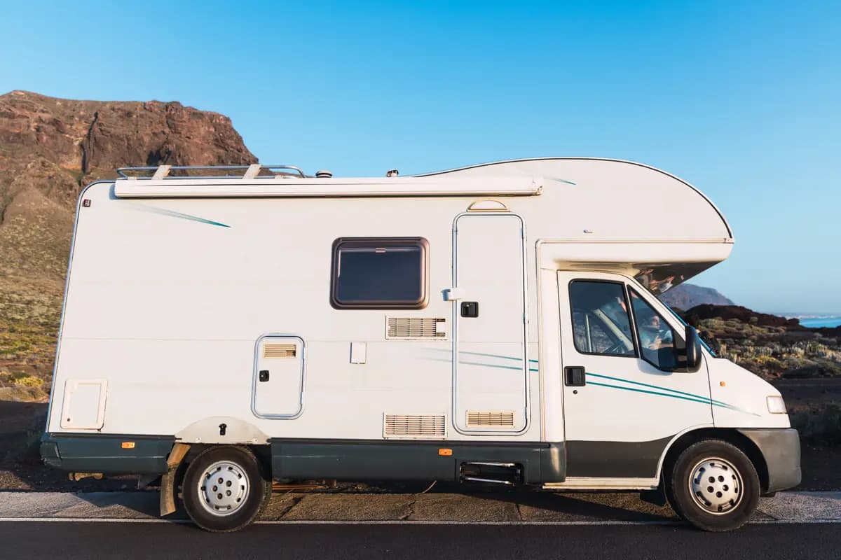 A recreational vehicle parked in mountainous country