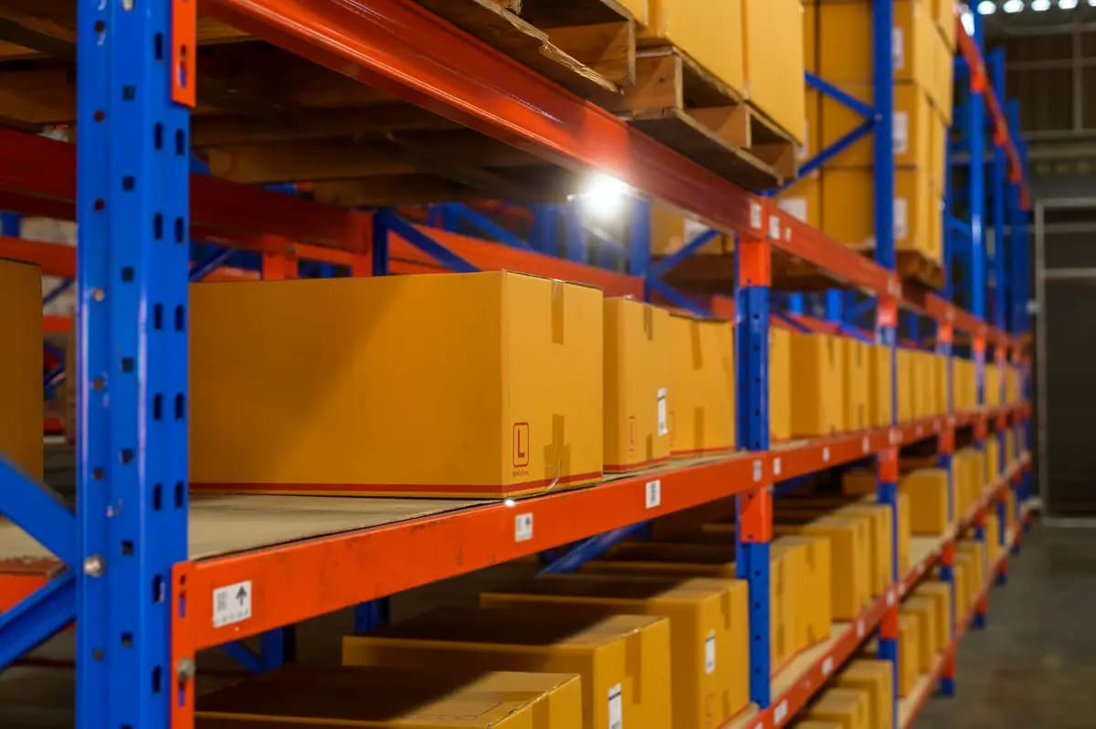 Cardboard boxes on shelves in a distribution warehouse