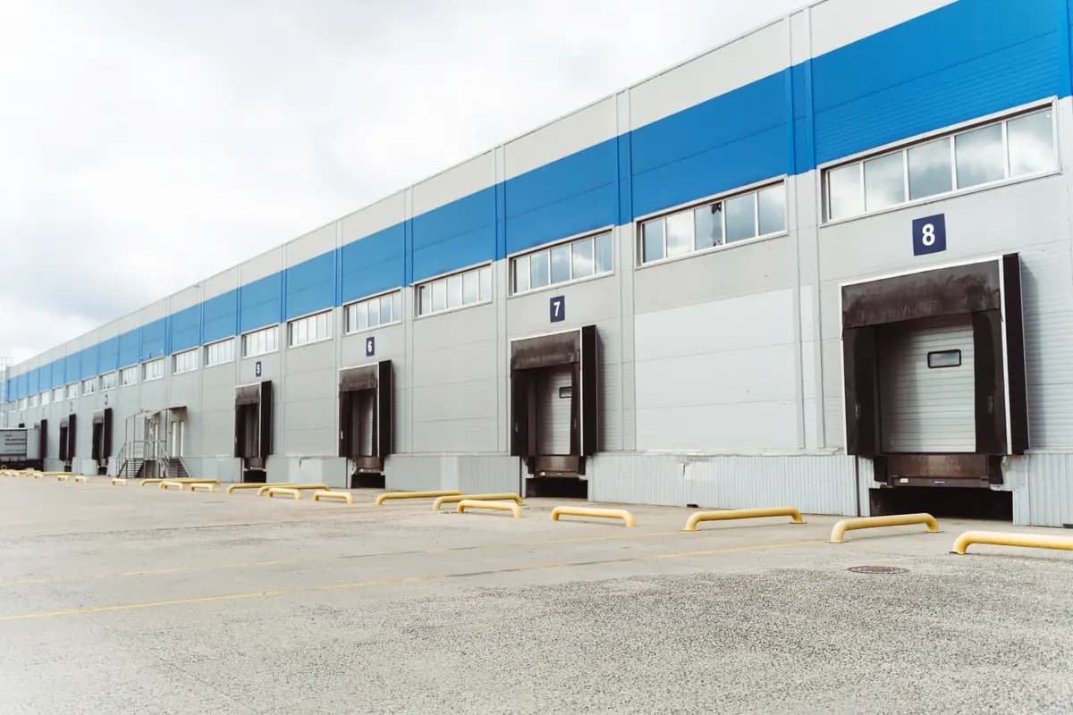 Industrial warehouse loading docks on a cloudy day