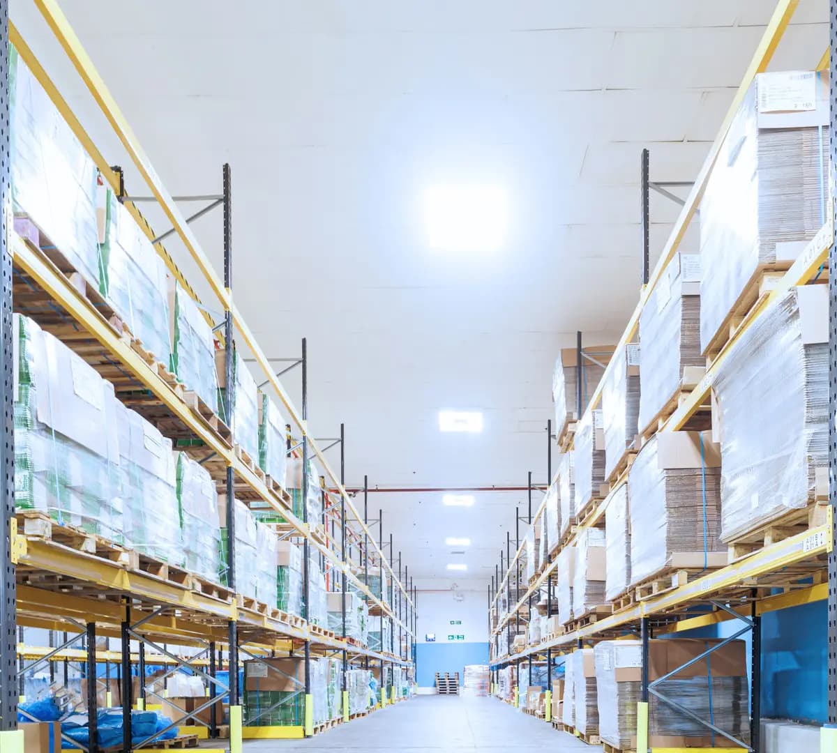 A warehouse interior with shelves of palletised goods