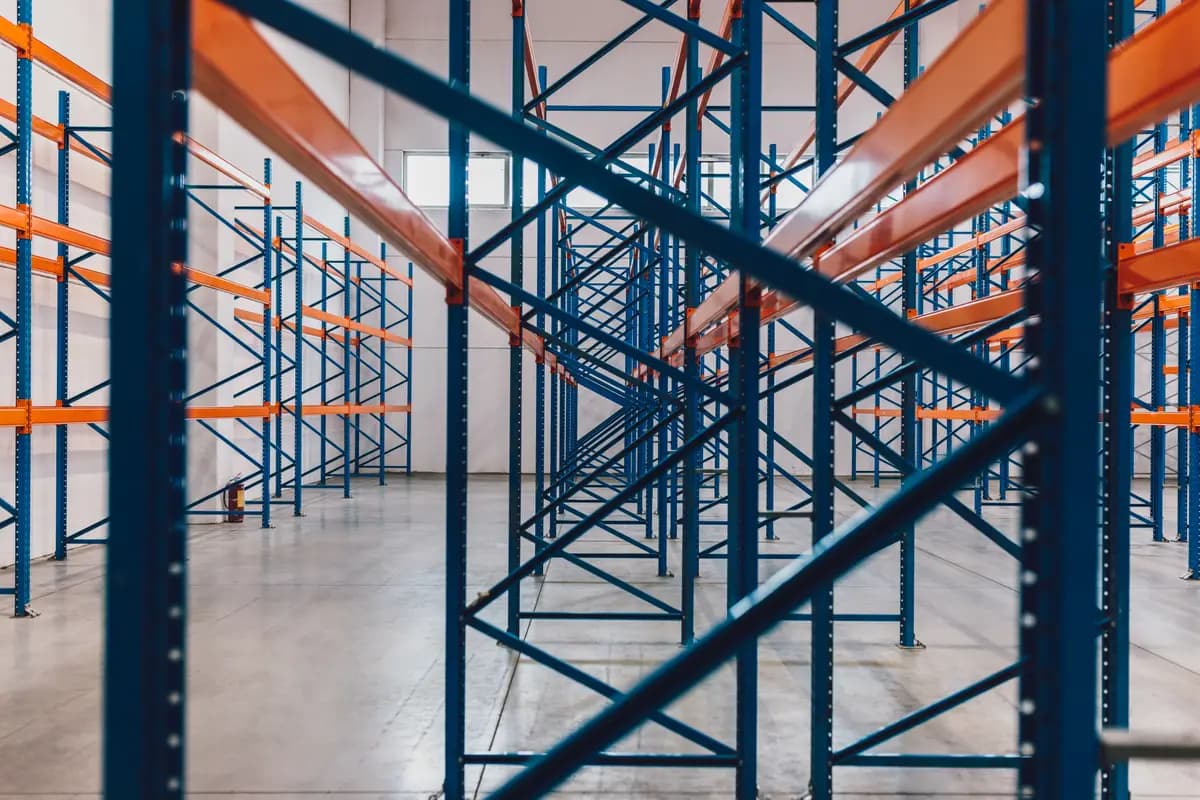 Empty blue and orange warehouse racking